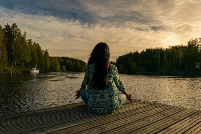Photo by leninscape yoga, woman, lake